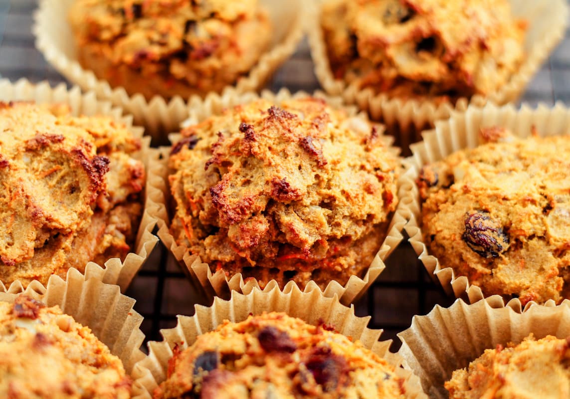 A batch of coconut flour muffins with carrots and raisins.