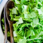 Overhead image of a bowl of lettuce salad.