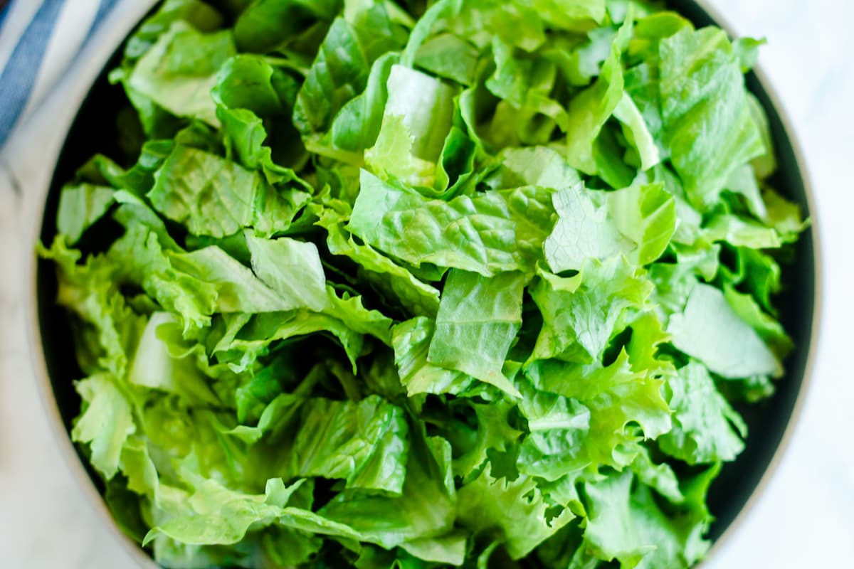 Overhead image of a bowl of lettuce salad.