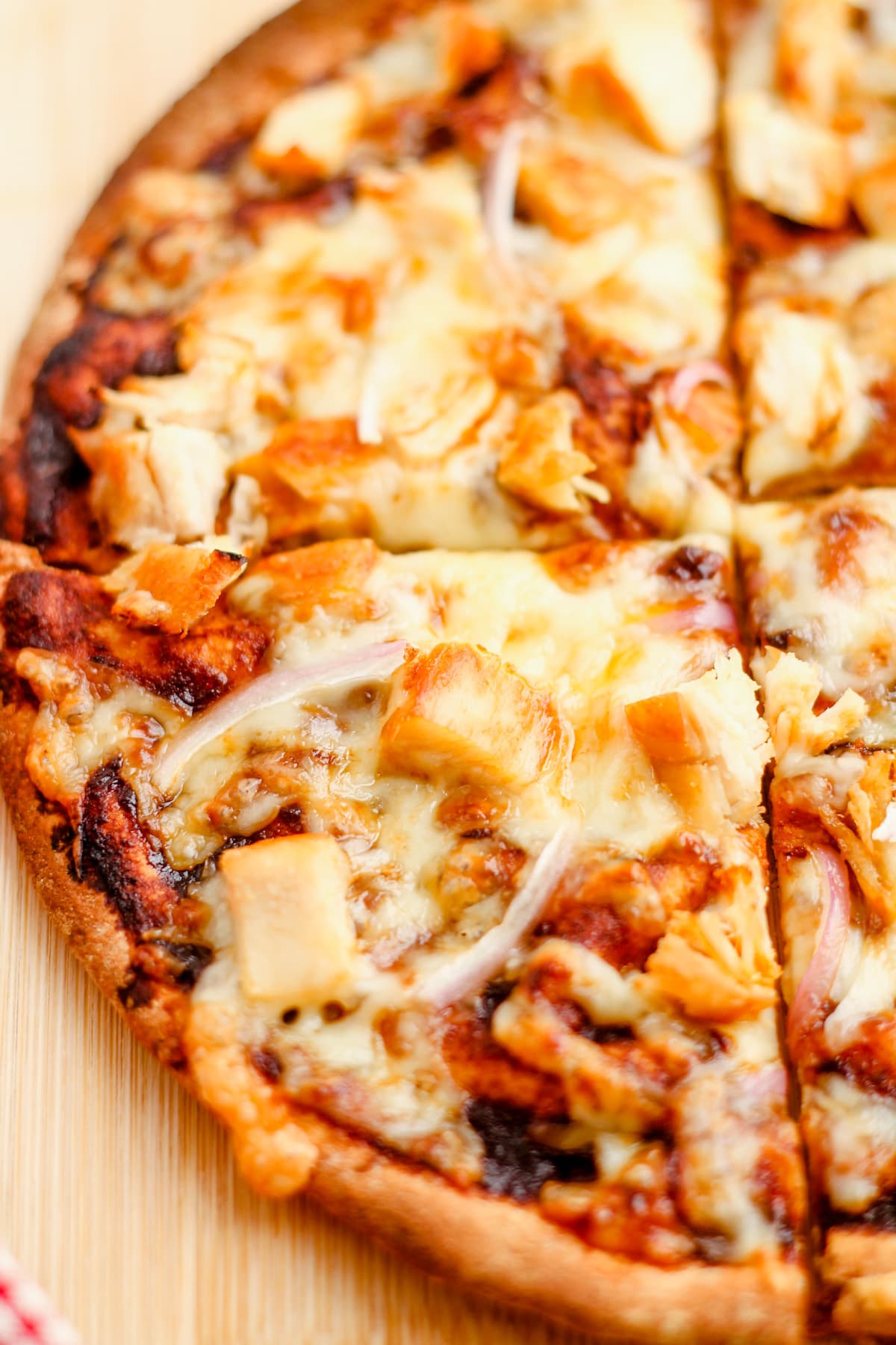 Pita pizza on a cutting board.