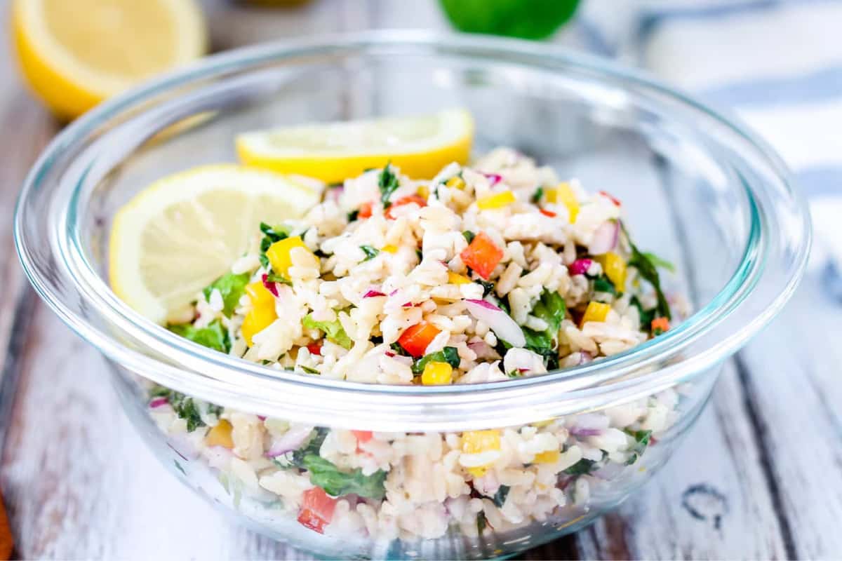 A bowl of chicken and rice salad.