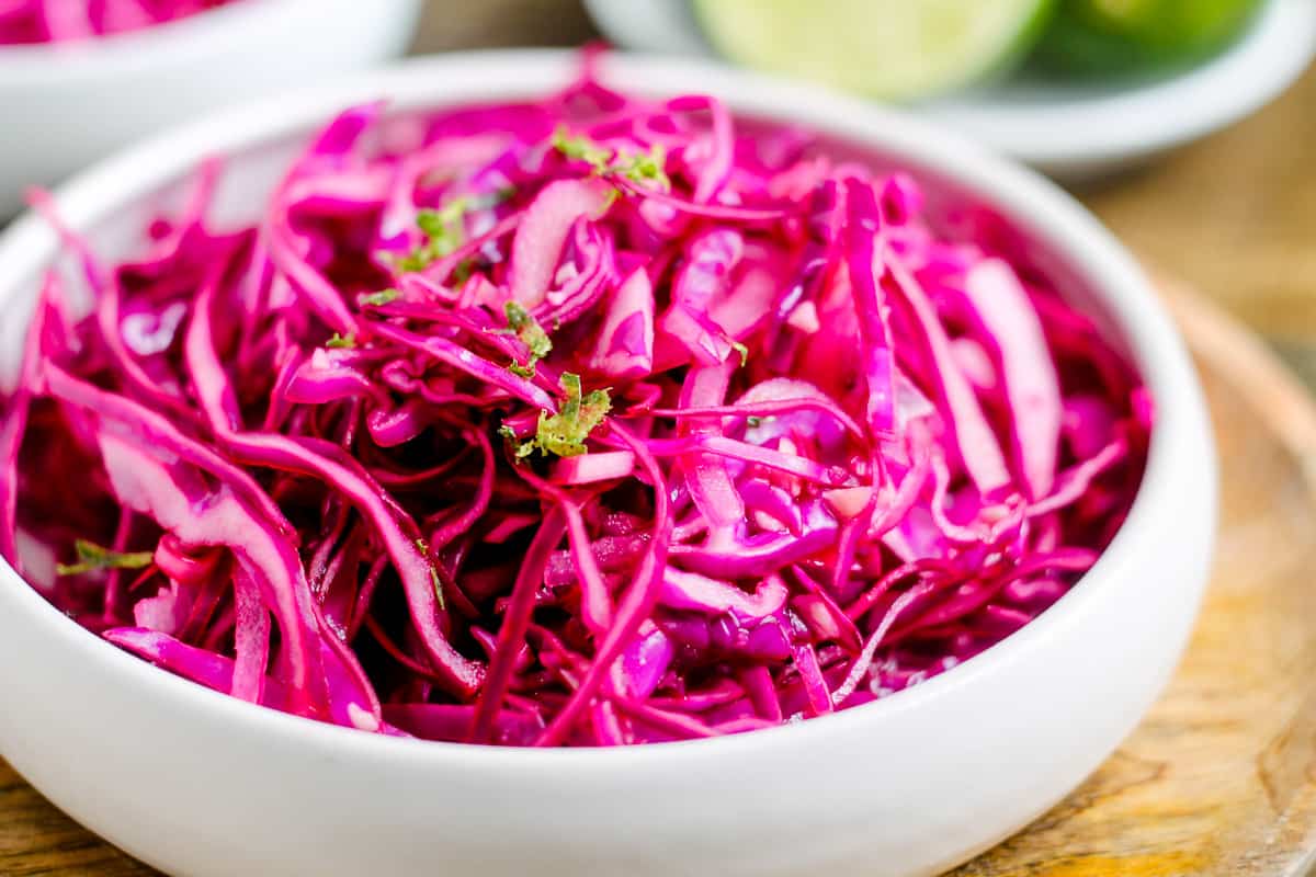A bowl of red cabbage slaw.