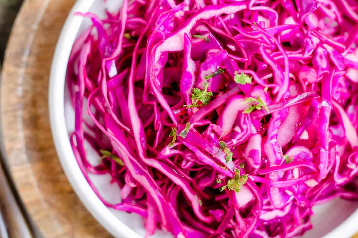 Overhead image of a bowl of red cabbage slaw.