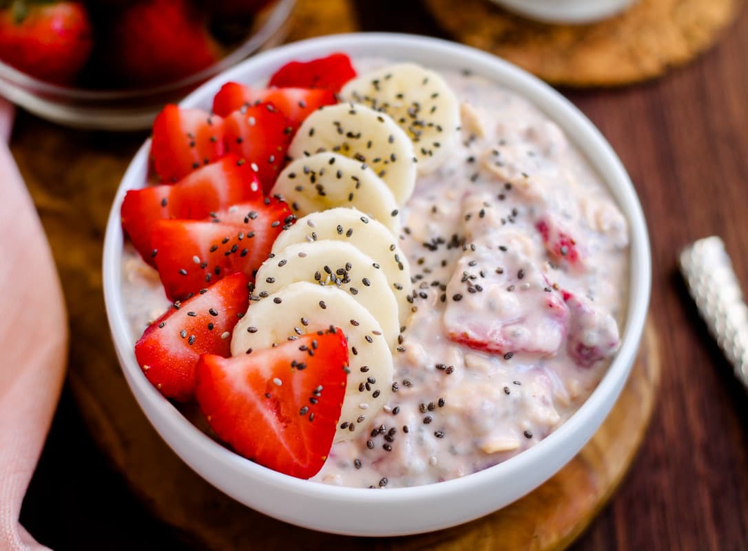 Overhead image of a bowl of strawberry overnight oats.