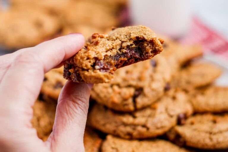 A hand holding a cookie.