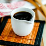 A container of soy-free soy sauce.