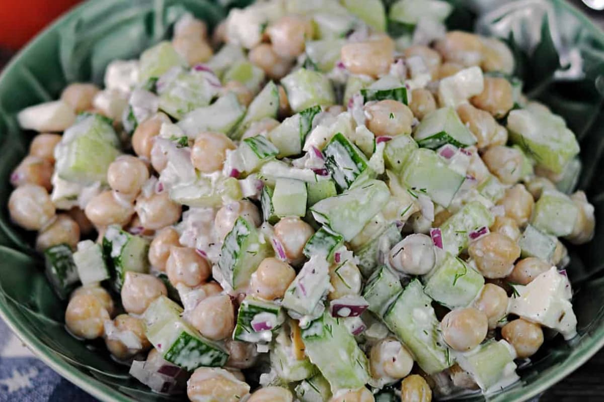 A bowl of cucumber chickpea salad.