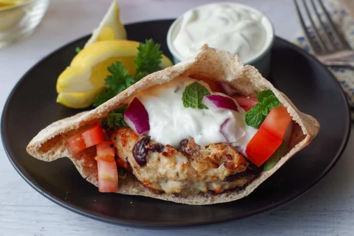 A plate of grilled greek chicken burgers.