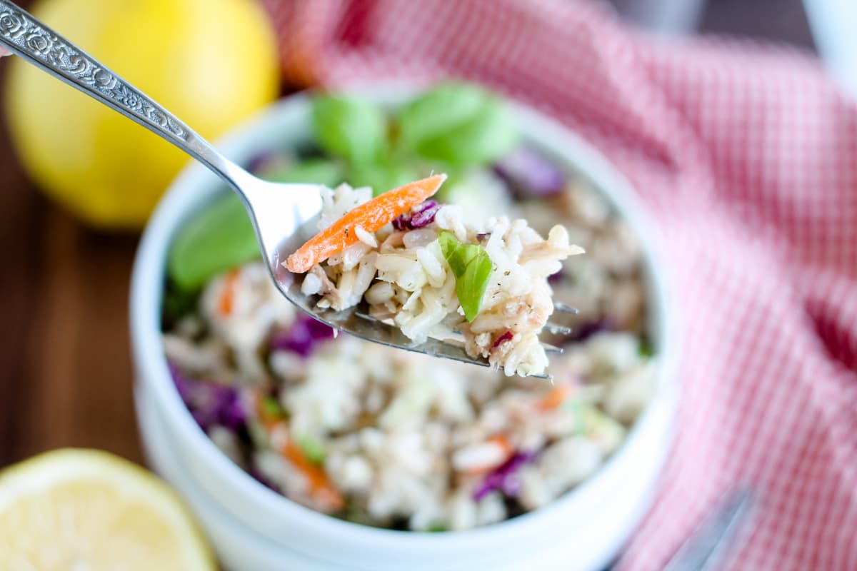 A forkful of rice salad with tuna.
