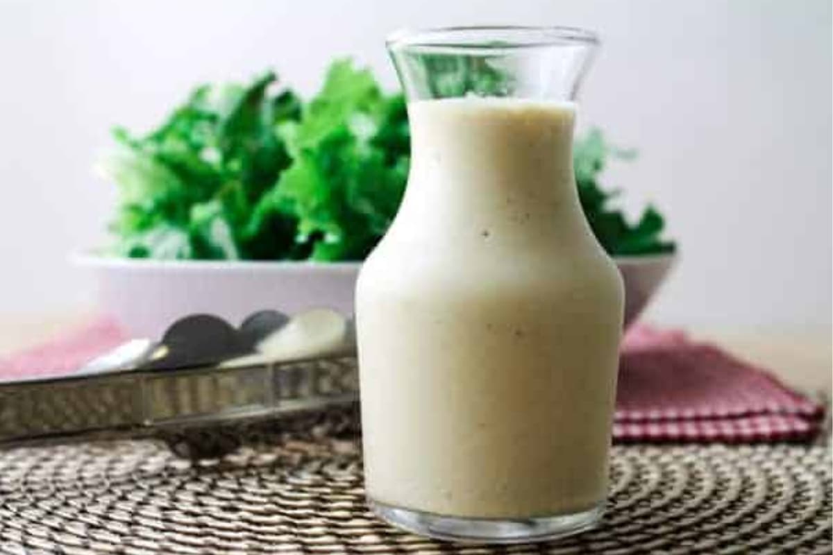 A jar of vegan salad dressing.