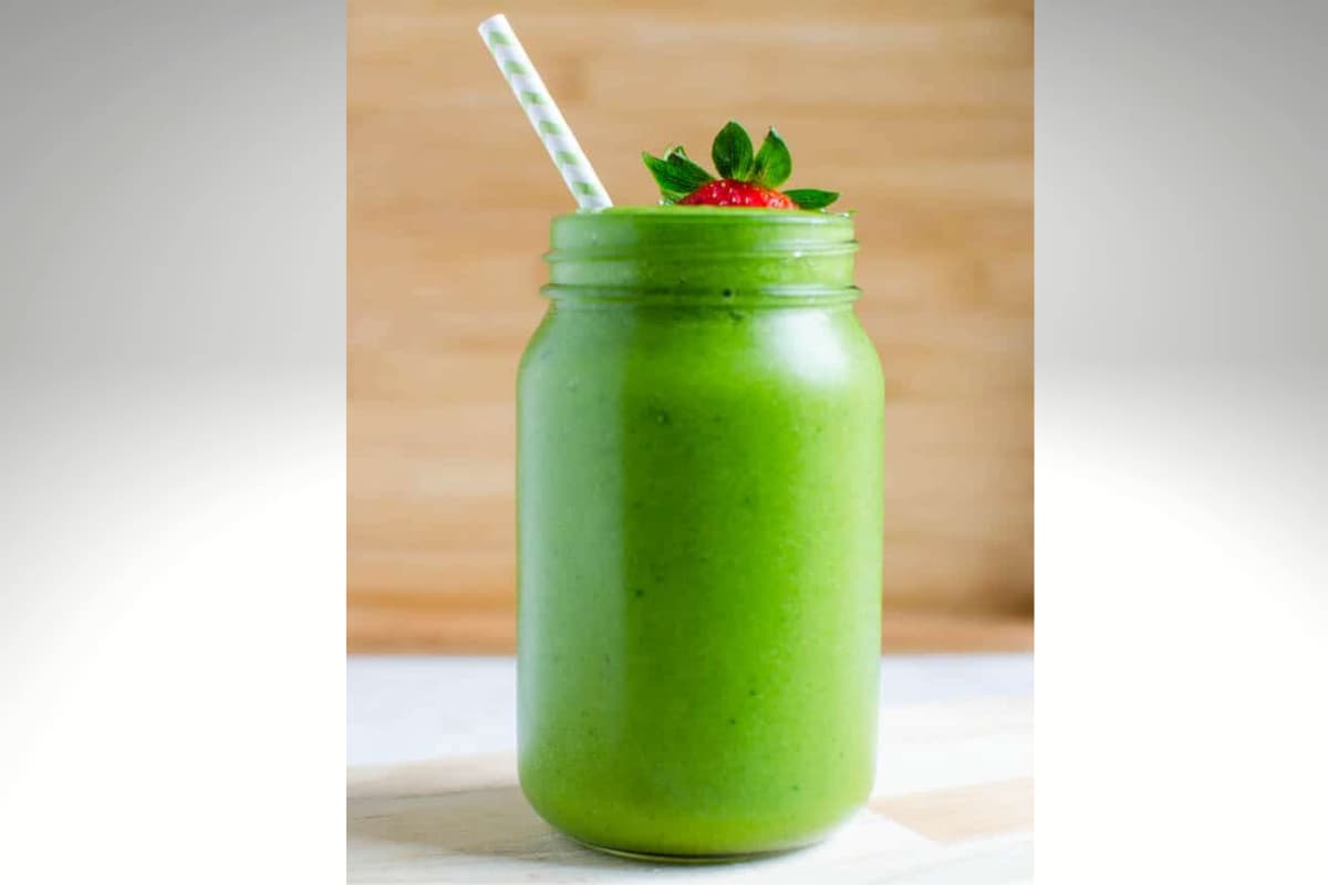 A glass of avocado green smoothie.