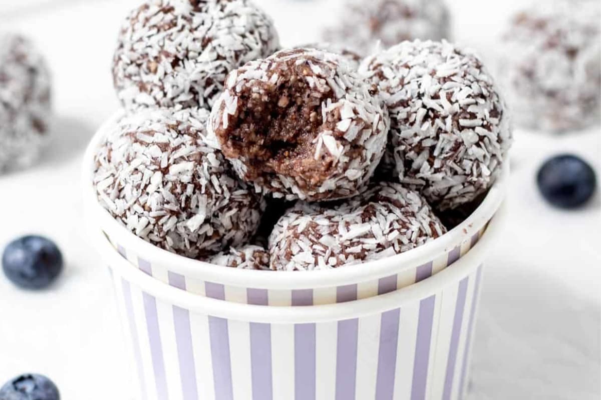 Blueberry bliss balls in a cup.