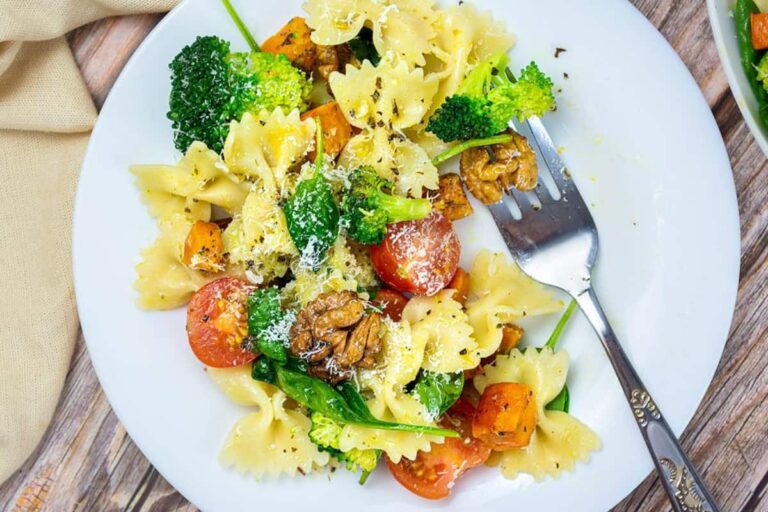 A bowl of broccoli pasta salad.