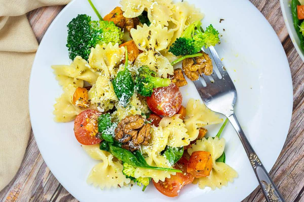 A bowl of broccoli pasta salad.