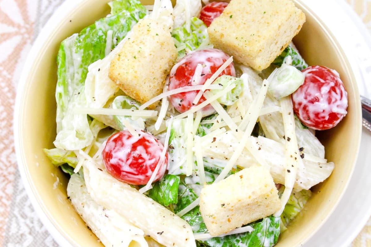 A bowl of Caesar pasta salad.