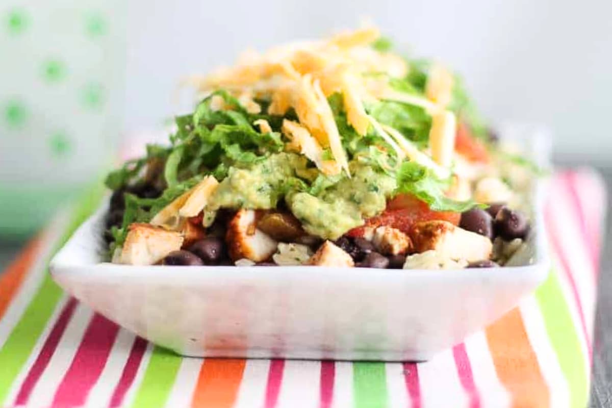 A chicken burrito bowl on a table.