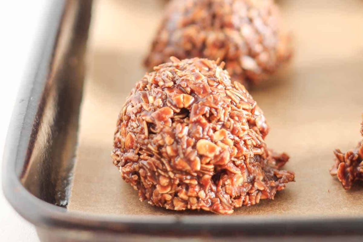 A tray of chocolate macaroons.