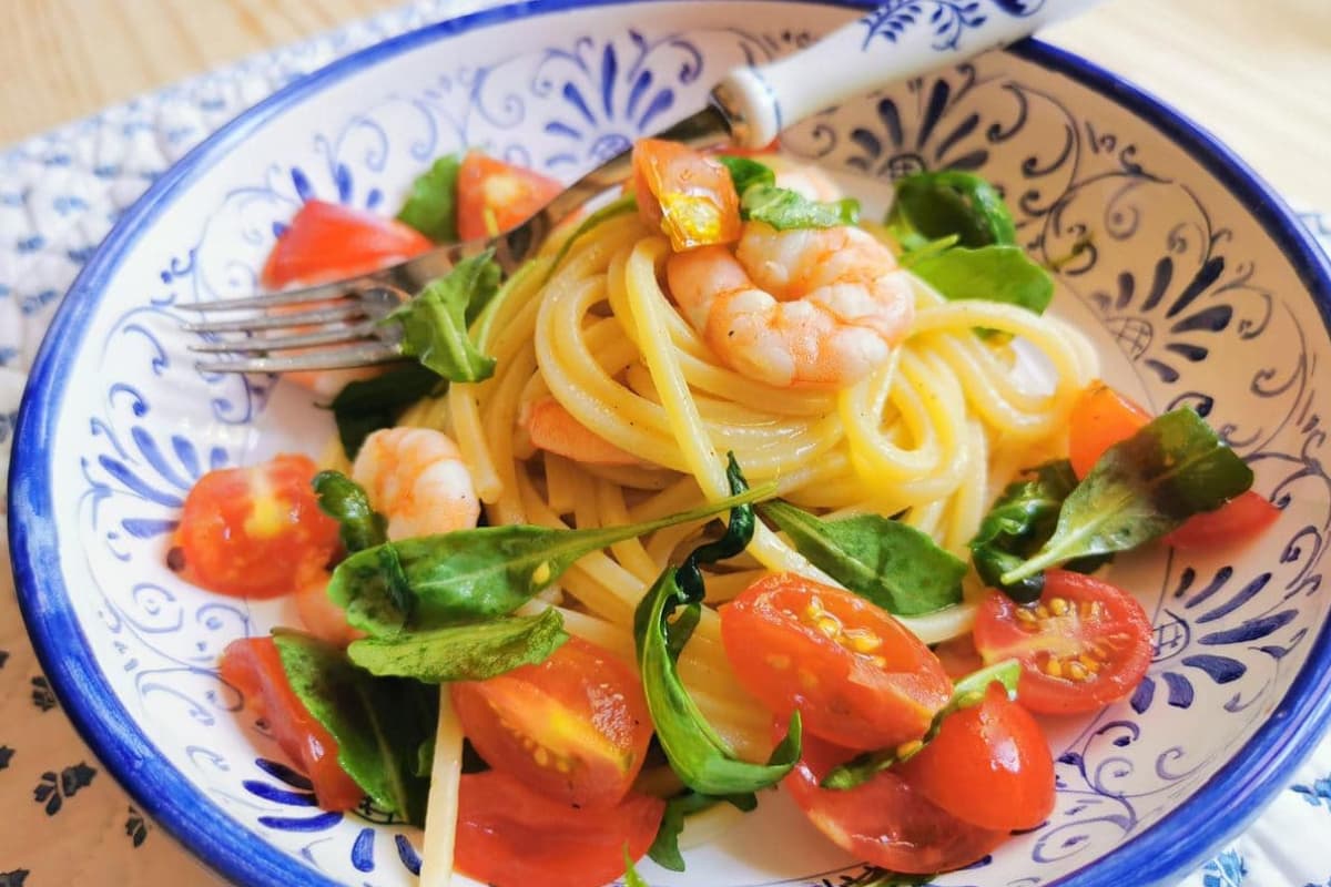 Cold spaghetti salad in a bowl.