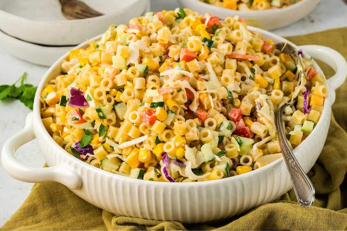 A bowl of cole slaw pasta salad.