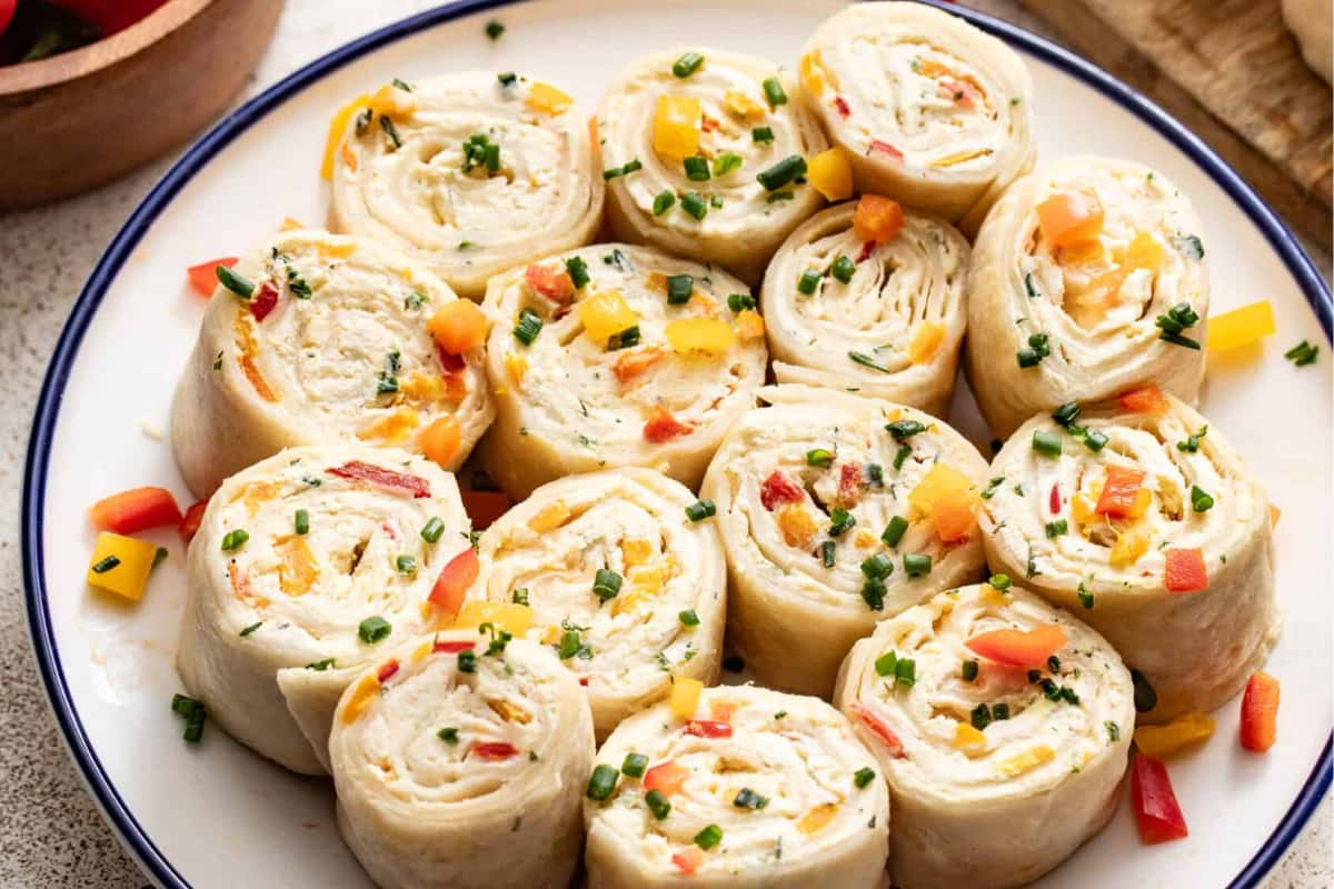 A plate of cream cheese tortilla rollups.