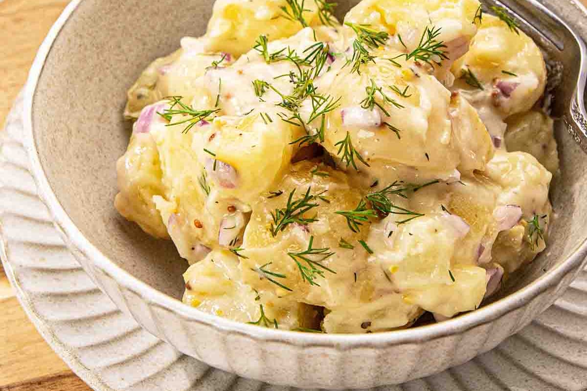 A bowl of creamy dill potato salad.