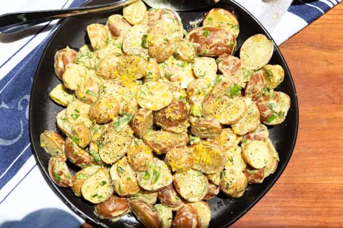 A plate of creamy herbed potato salad.