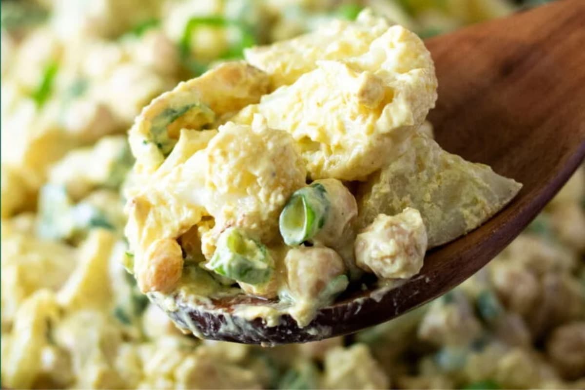 A spoonful of curry cauliflower potato salad.