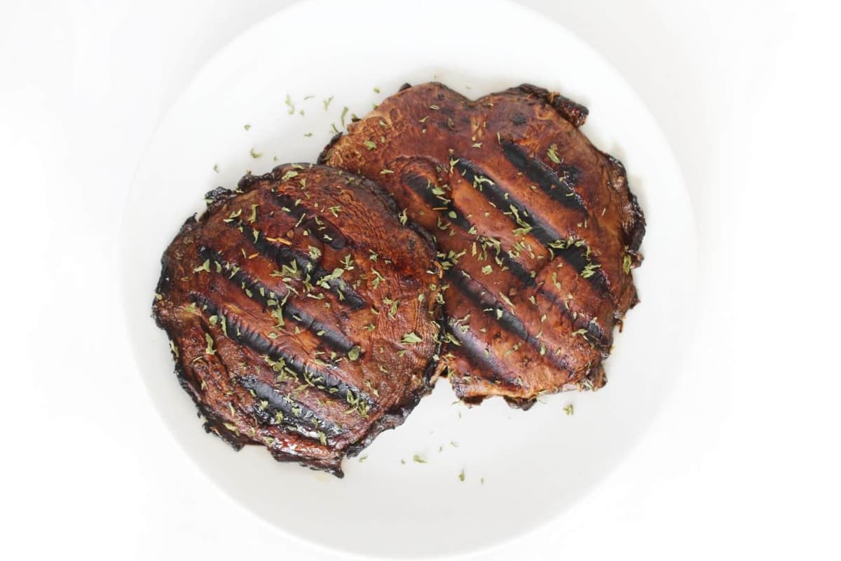 Grilled portobello mushrooms on a plate.