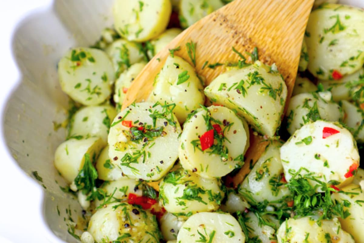 A herbed potato salad in a bowl.