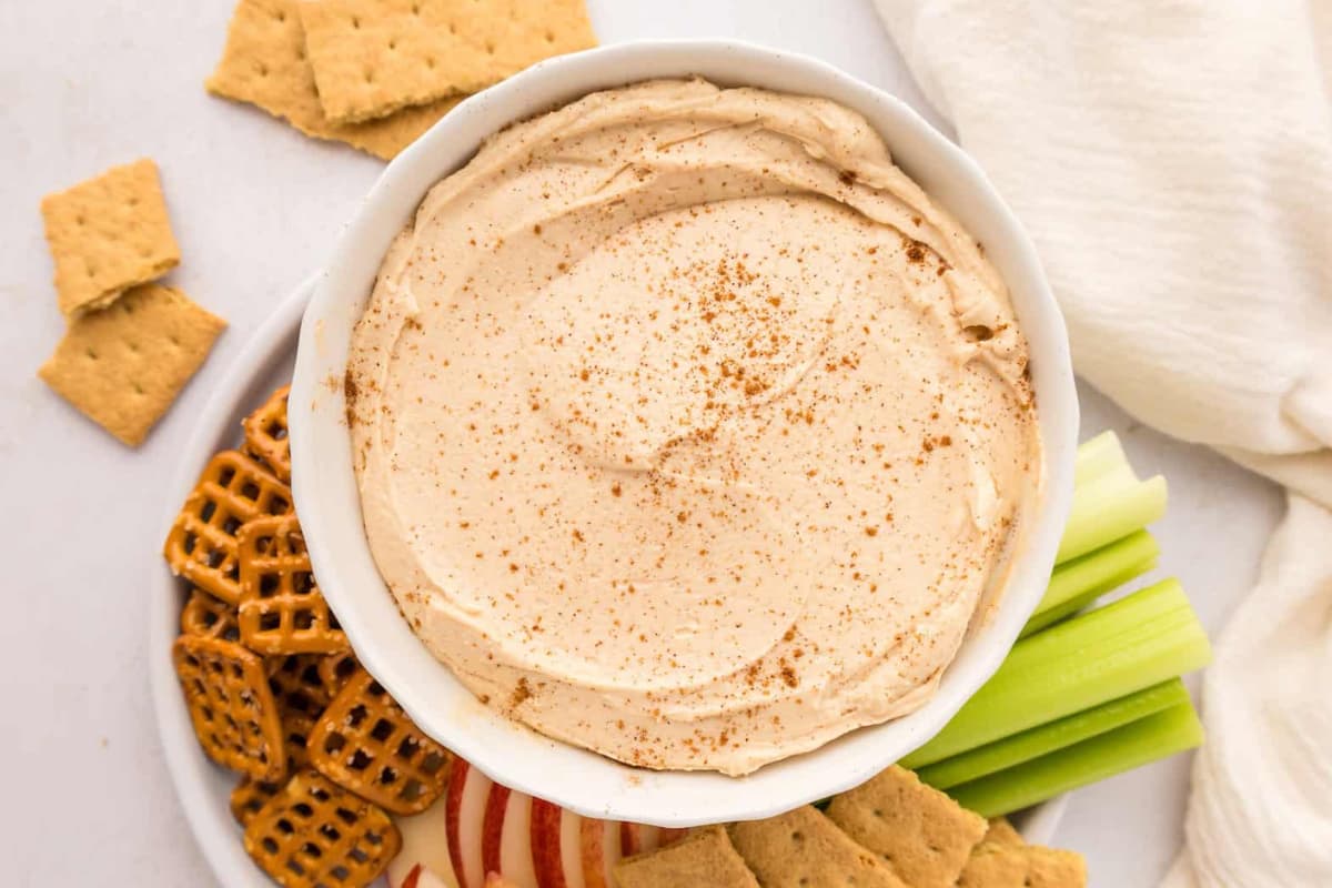 A bowl of peanut butter yogurt dip.