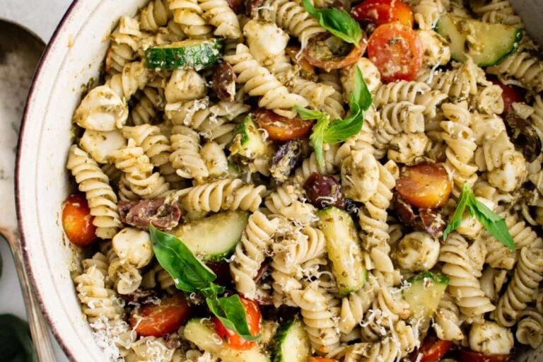 A bowl of pesto pasta salad.