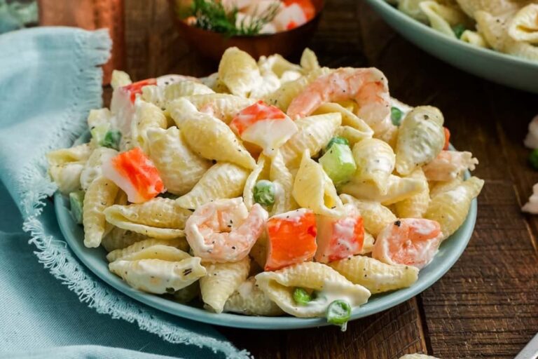 A bowl of seafood pasta salad.