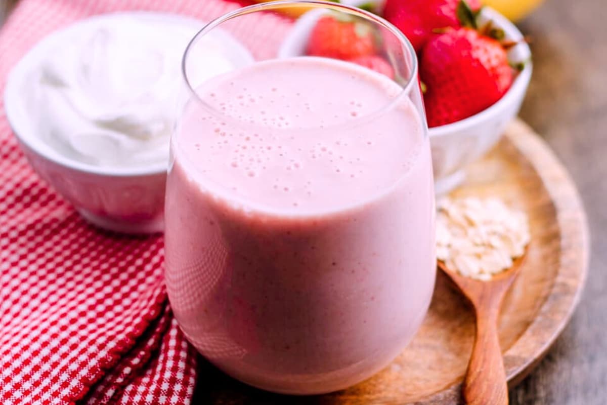 A glass of strawberry breakfast smoothie.