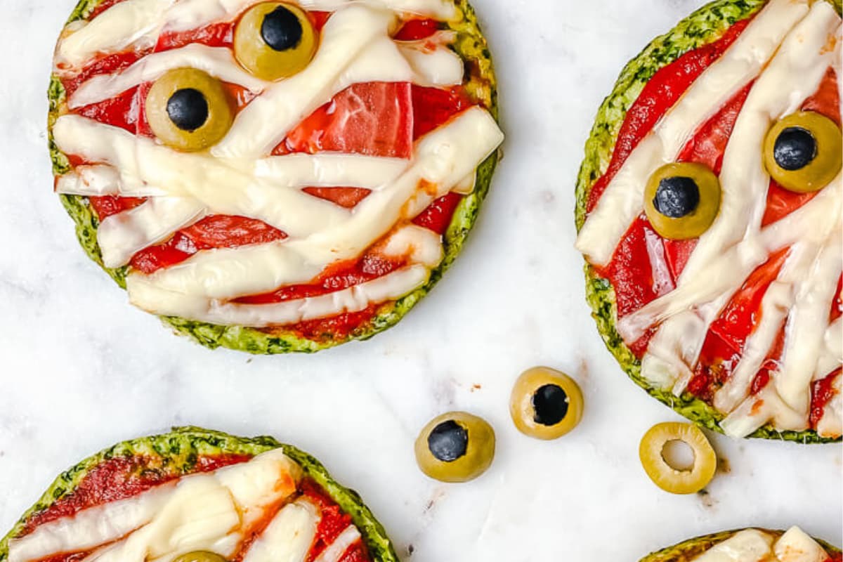 A platter of Halloween pizzas.