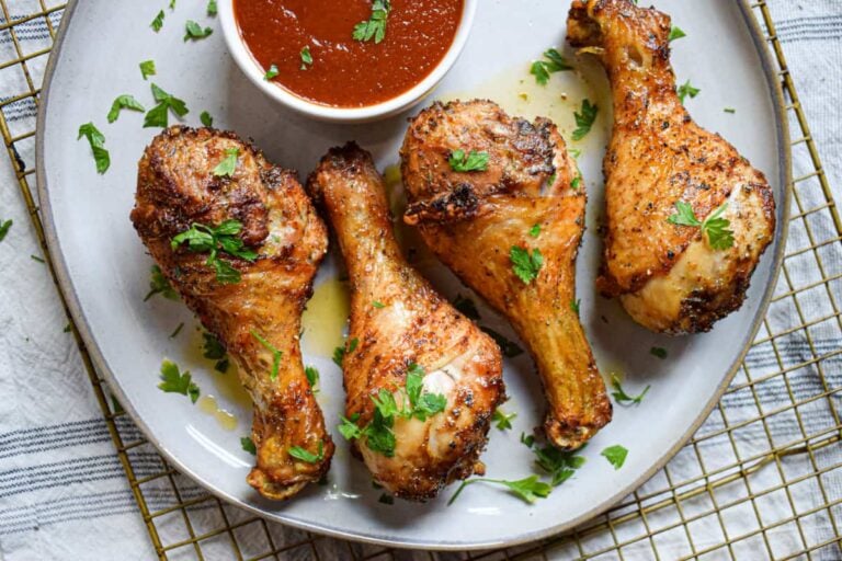 A plate of air fryer chicken legs.