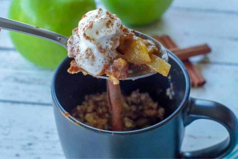 An apple crisp in a mug.