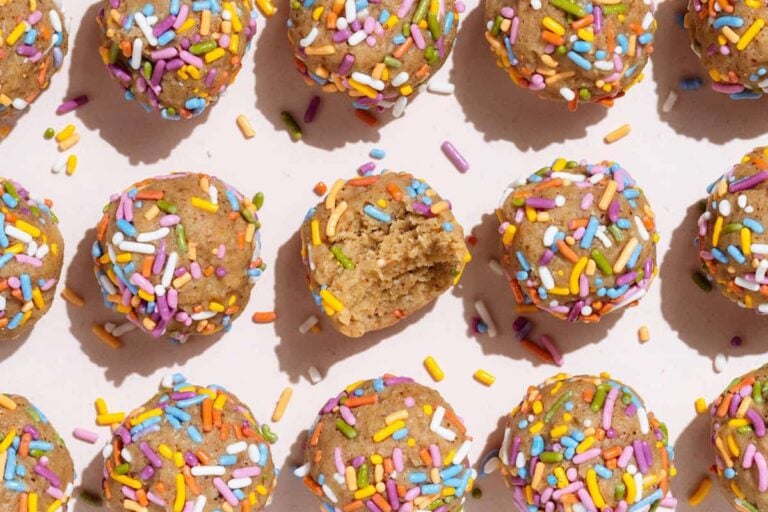 Birthday cake protein balls on a counter.