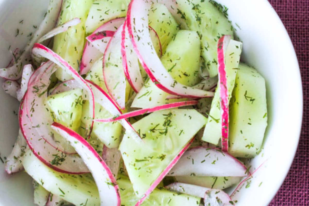 A bowl of cucumber salad.