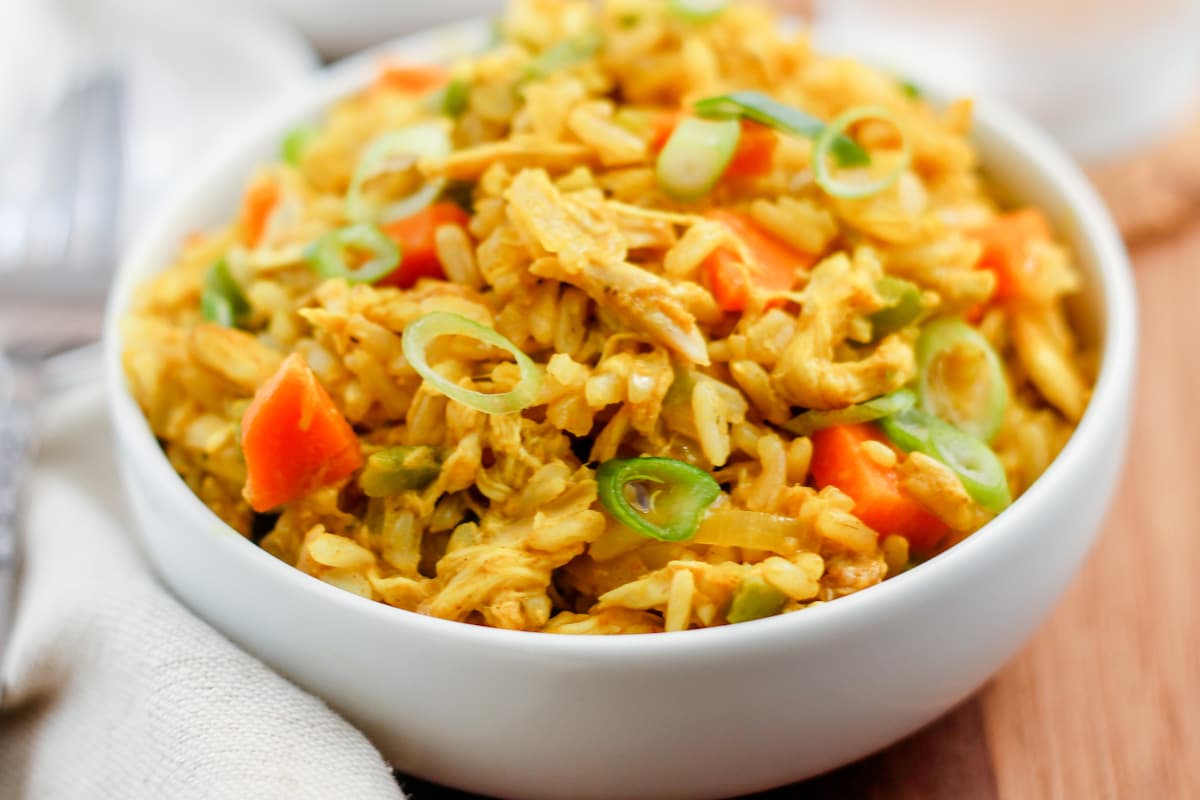 Curry chicken rice bowl on a table.