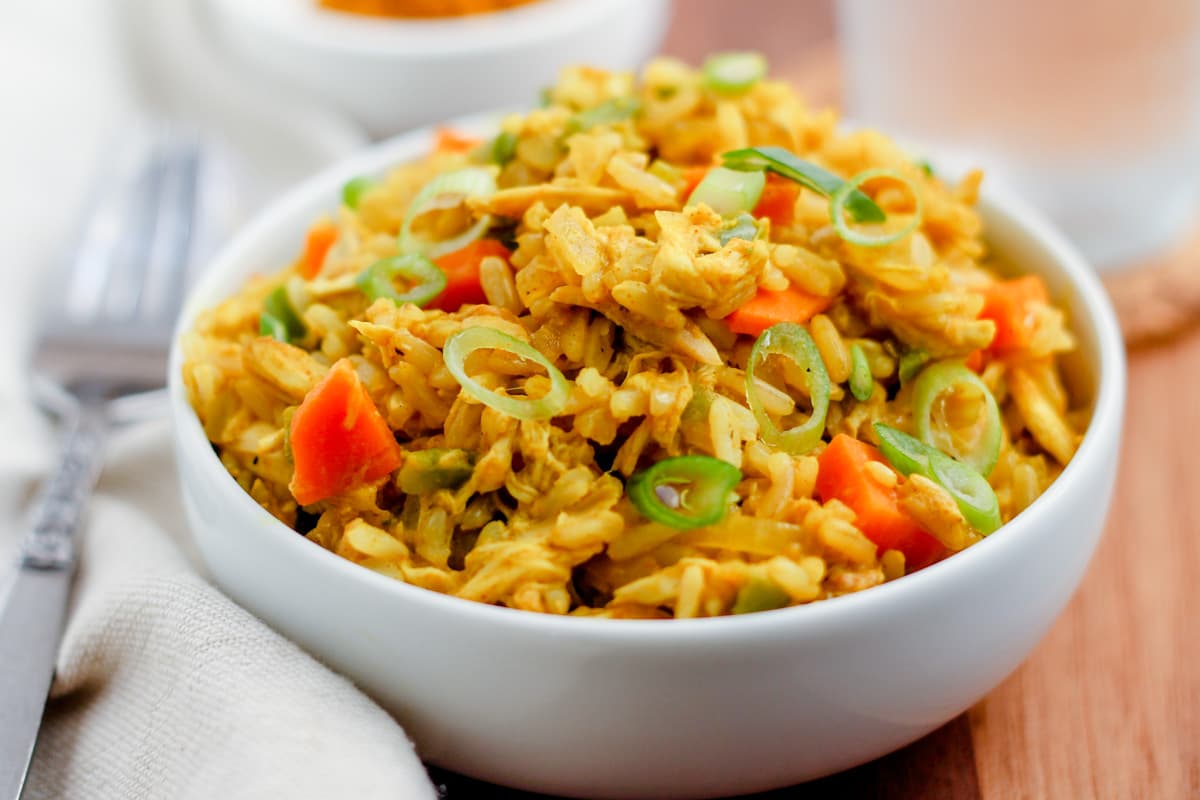 Curry chicken rice bowl on a table.