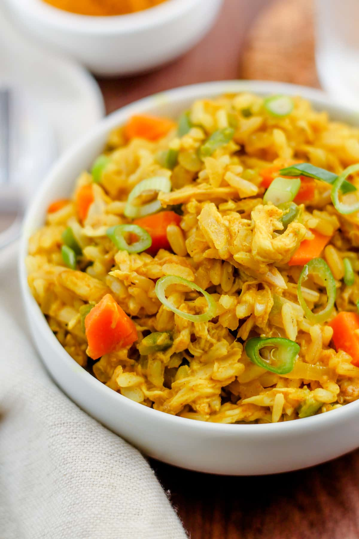 Curry chicken rice bowls on a table.