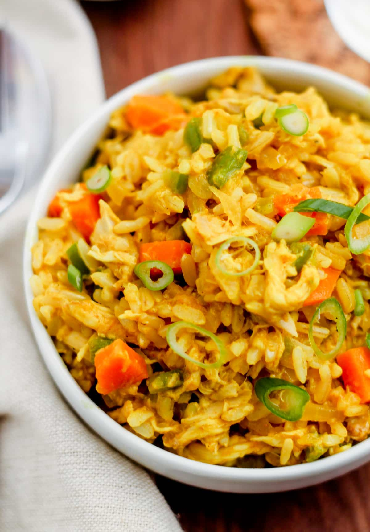 Curry chicken rice bowls on a table.