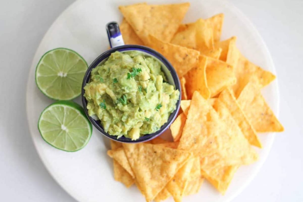 A plate with a dish of easy guacamole.