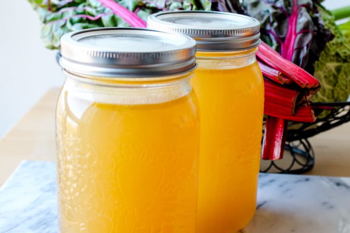 Jars of homemade vegetable broth.