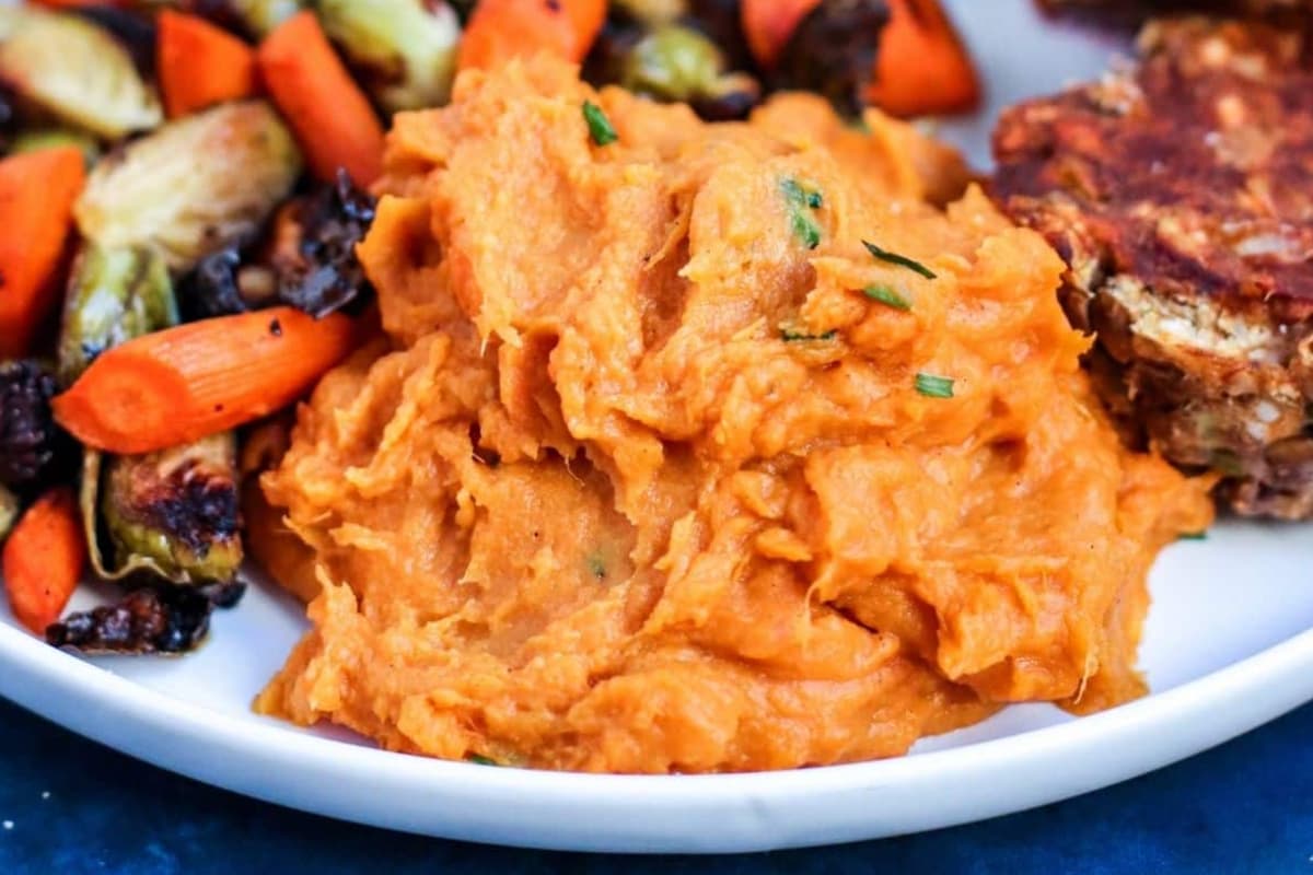 A plate of vegan mashed sweet potatoes.