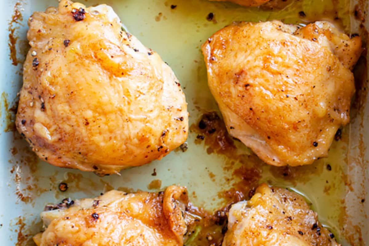 A pan of roasted chicken thighs.