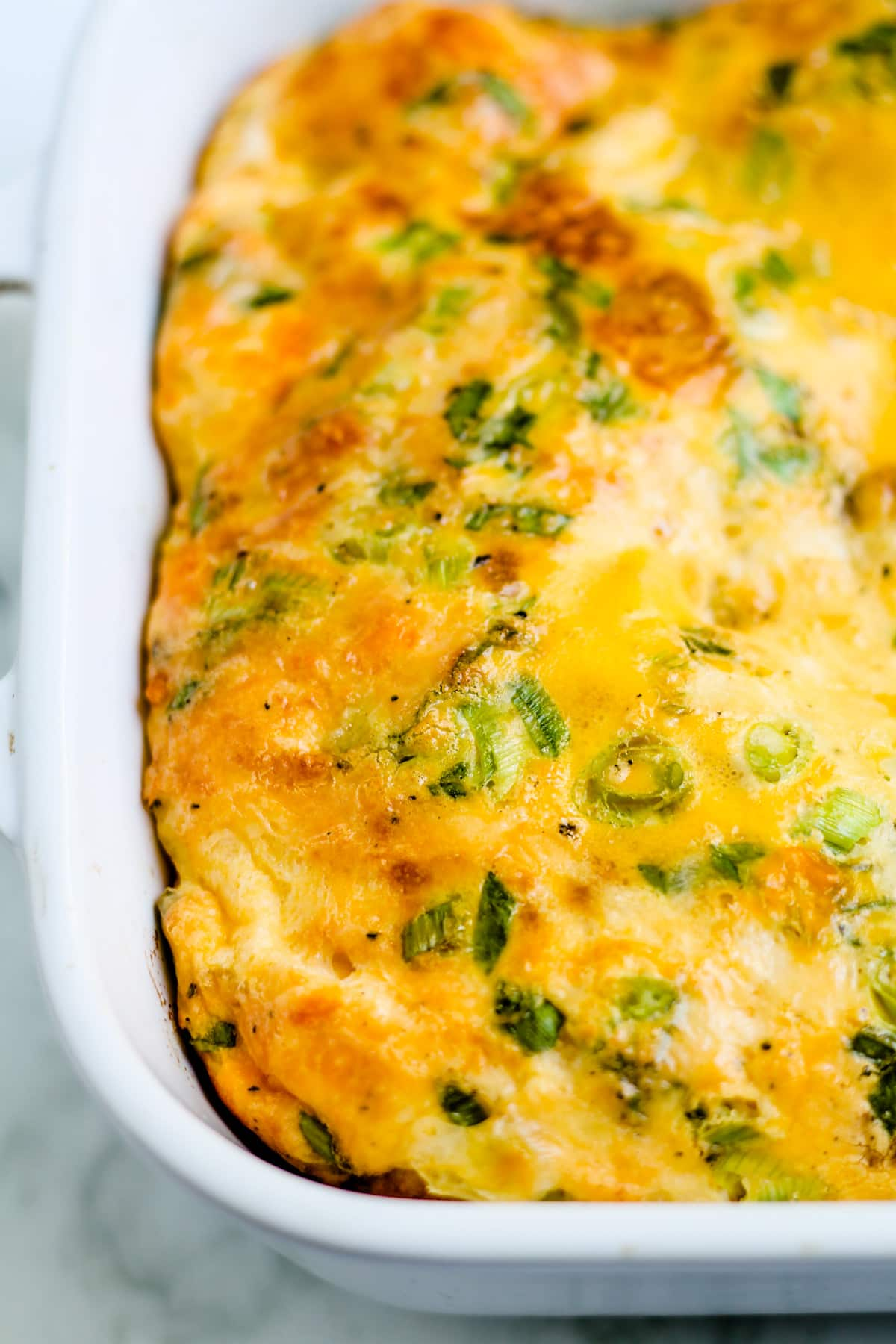 Overhead image of an egg casserole in a baking dish.