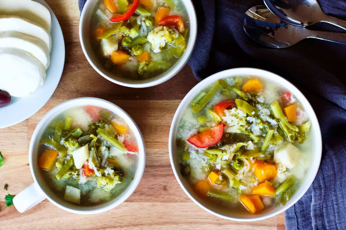 Bowls of Romanian vegetarian sour soup.