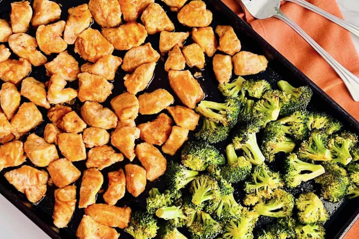 A sheet pan of buffalo chicken and broccoli.