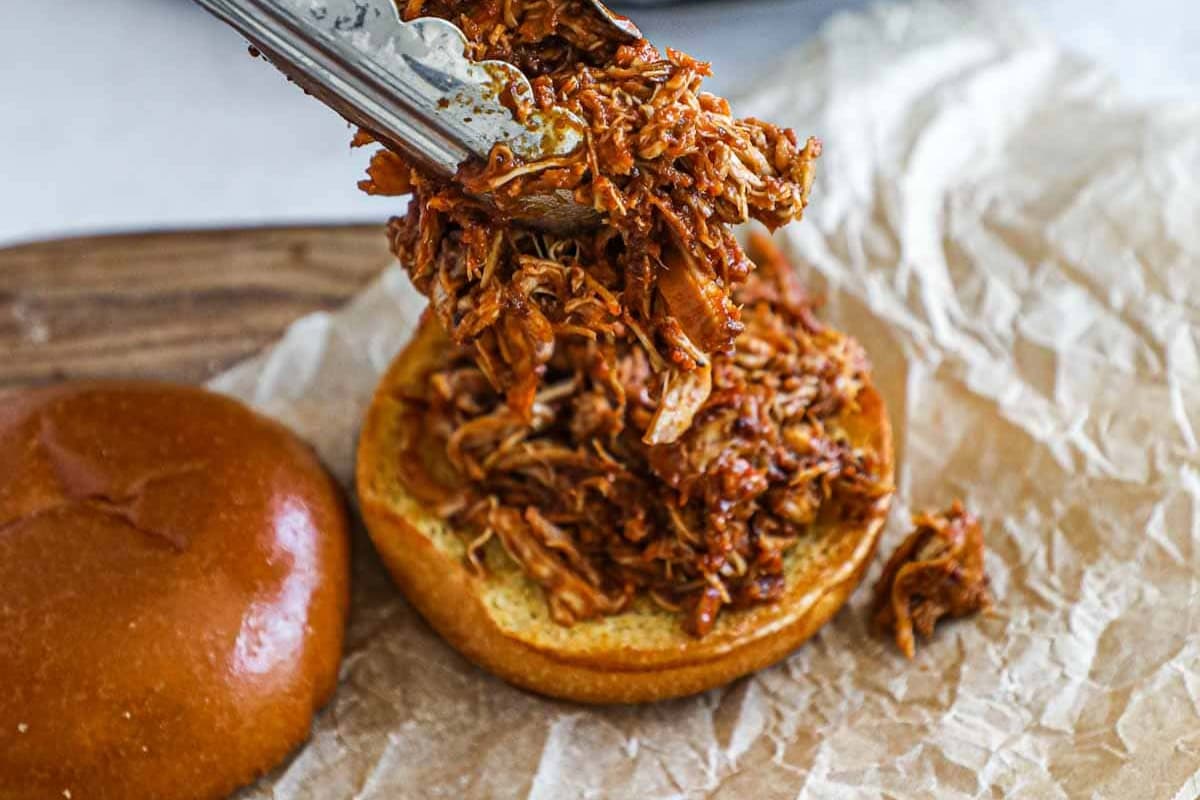 Slow cooker pulled bbq chicken on a bun.